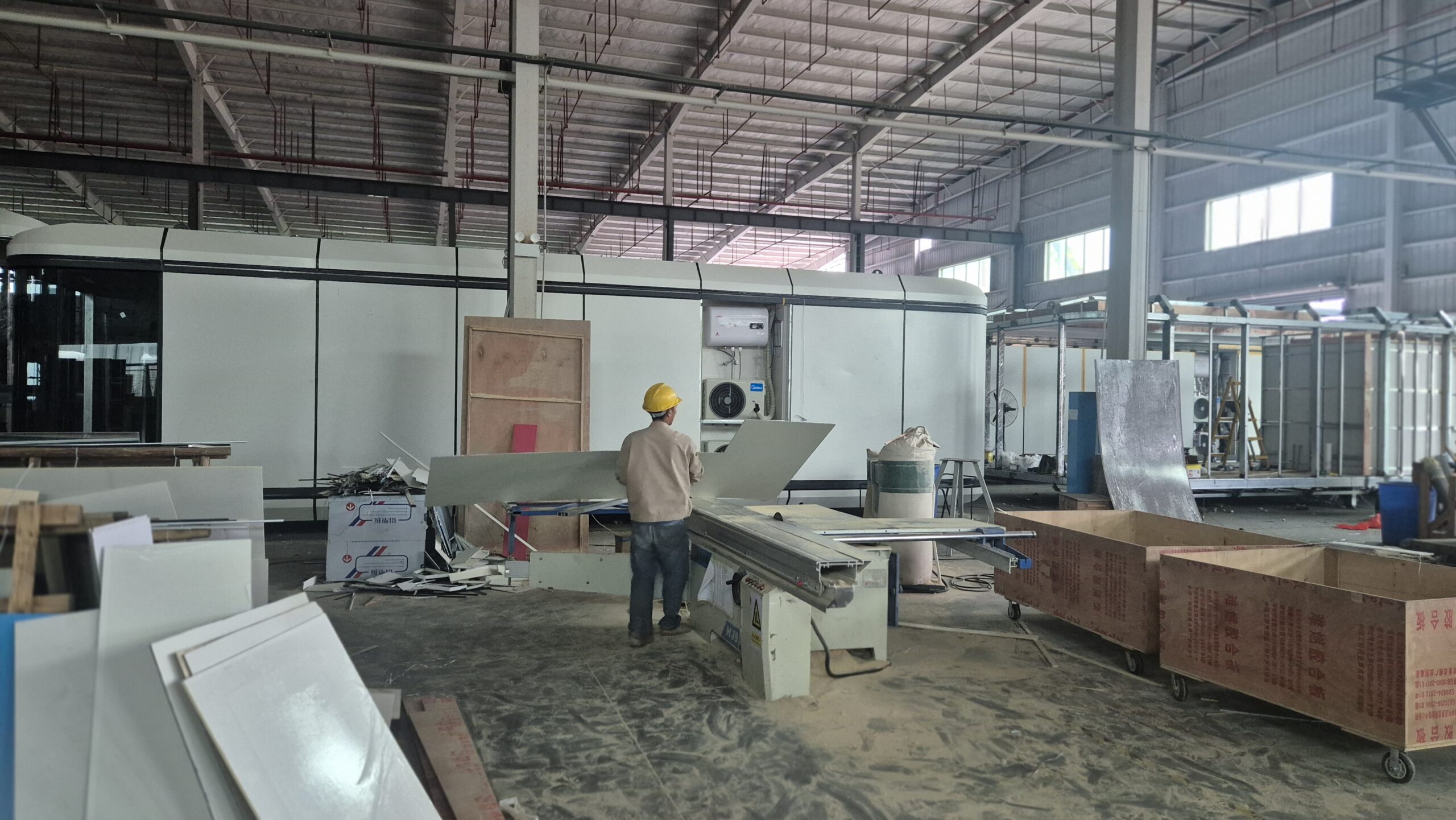 Workers on the 8IHouse production line